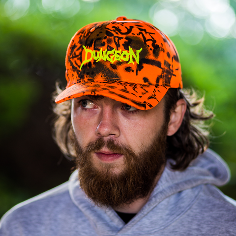 DUNGEON LOGO -  ORANGE FOREST CANVAS CAMO CAP
